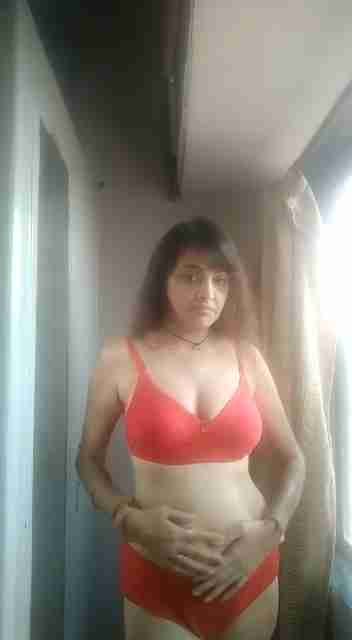Indian Bhabhi Seduces in Red Dress Leaked MMS